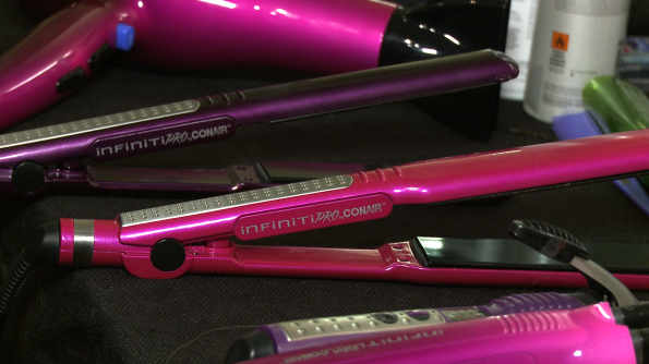 Smooth out your locks with a Conair flat iron (hot pink doesn't hurt ;) 